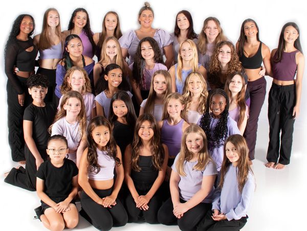 Large group of diverse young girls posing for a photo.