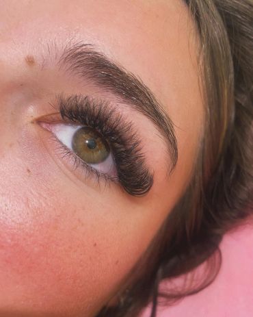 Close-up of an eye with thick eyelash extensions.