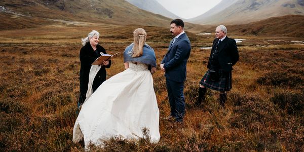 Newlywed couple elopes at Glencoe Scottish Highlands. Elopement Image by Laura Kemp Photography.