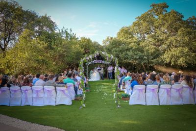 Outdoor wedding under the pergola at The Meadows Wedding Venue.