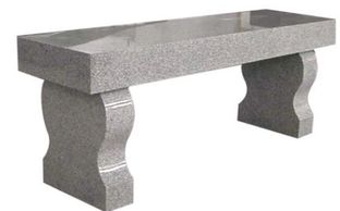 A polished granite bench with curved legs.