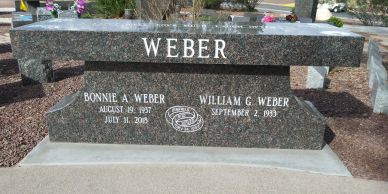 Granite memorial bench with the name Weber and dates for Bonnie and William Weber.