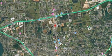 Aerial view of Baytown, Texas with neighborhoods, roads, and landmarks visible.