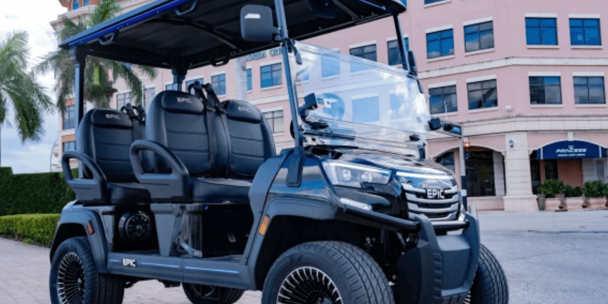 Used EPIC electric golf cart in black with six passenger seating and spoke wheels parked outside com