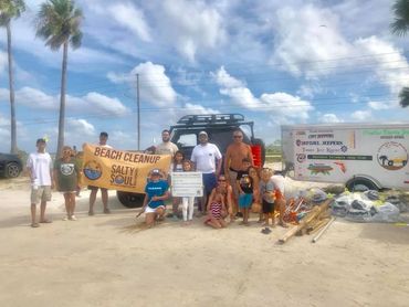 Volunteers at a beach clean-up with GreenPolly bags