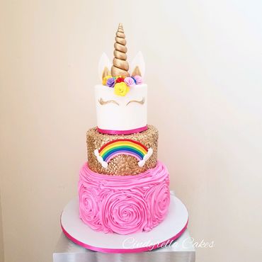 3 tier unicorn cake with rainbow. 