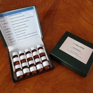 A set of essential oil bottles in a box with a usage guide.