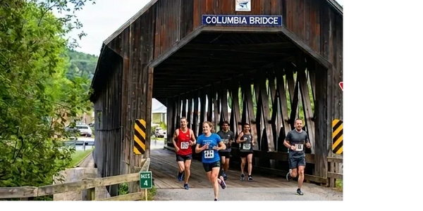 Runners crossing the historic Columbia Bridge during a race.