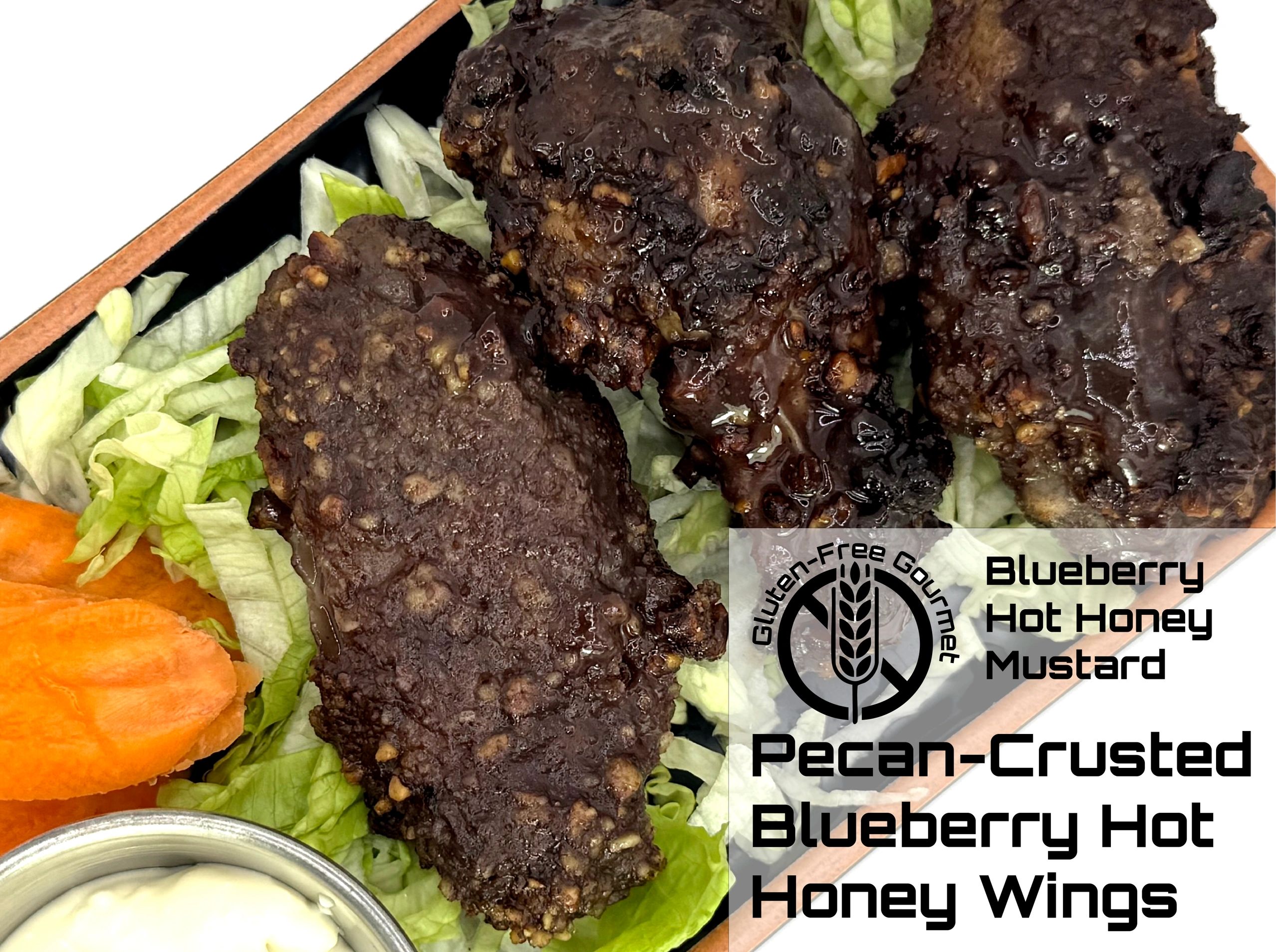 Pecan-crusted blueberry hot honey wings on lettuce with carrot slices and dip.