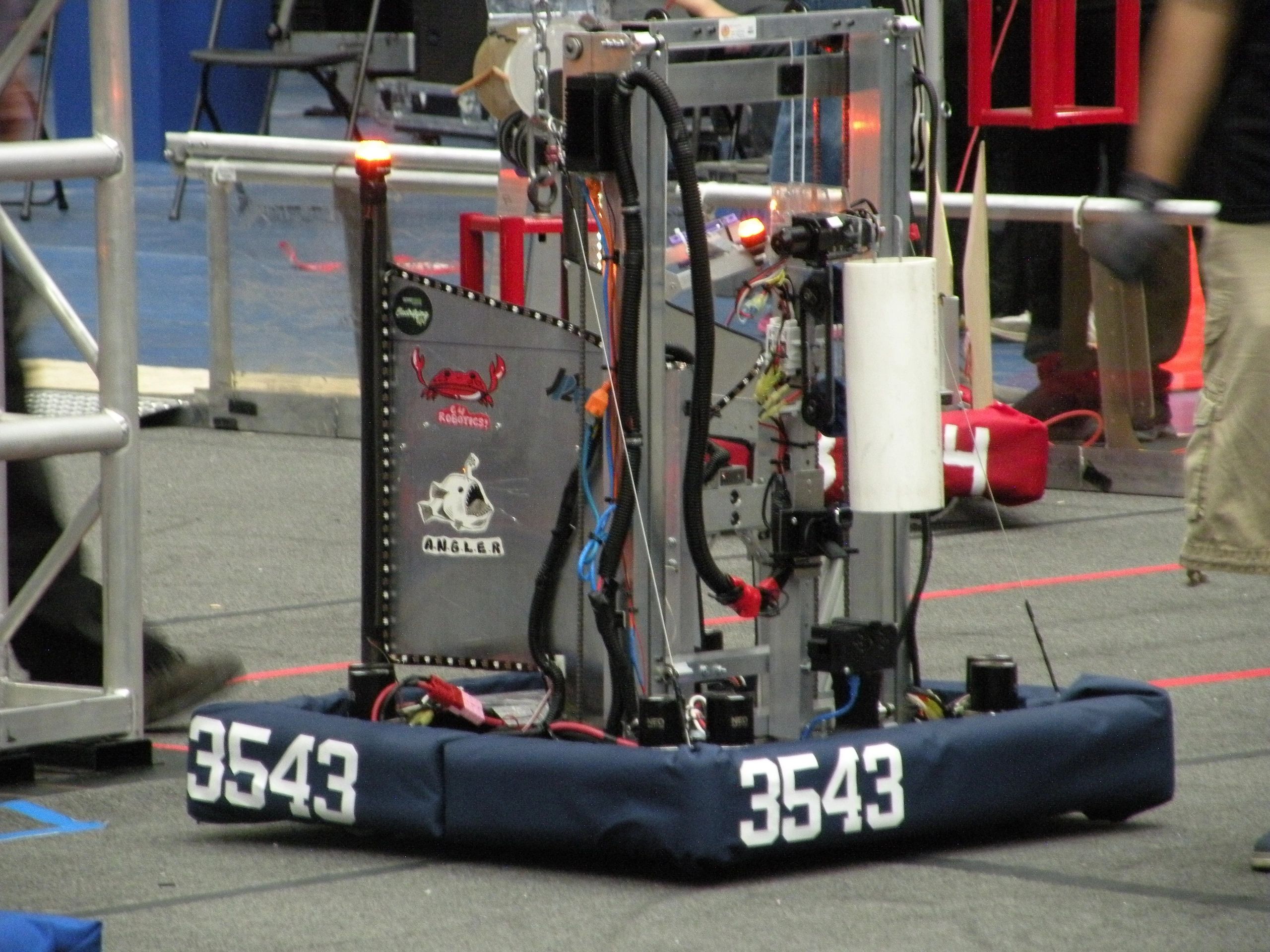 Competition robot with team number 3543 and marine-themed stickers on side panel.