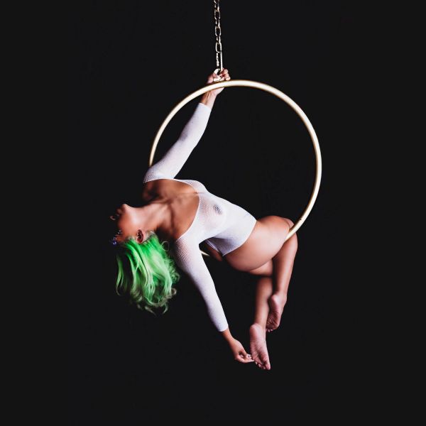 Black woman posing on lyra hoop at her boudoir session in OShawa.