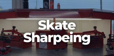 Skate sharpening machines lined up on a counter for maintenance.