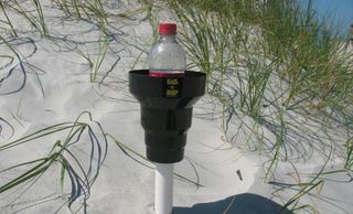 Beach cup holder holds your drink out of the hot messy sand at the beach. KAZeKUP Beach Drink Holder