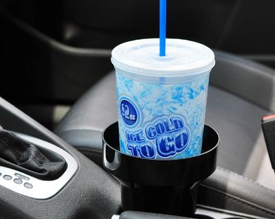 Car Cup Holder Insert holding a large drink. The KAZeKUP® Ultimate Cup Holder holds your drinks securely and catches spills and drips.