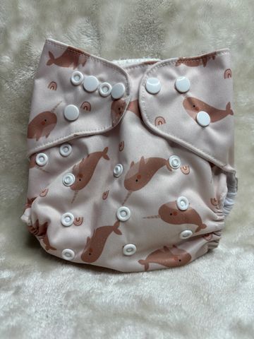Eco- Friendly narwhale print with water resistant outer layer and cotton layered inside. Comes with 