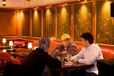 Chicago, Illinois, The Drake Hotel, Coq d'Or Bar, Customers seated at table.