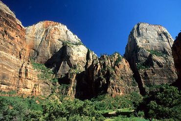 Zion National Park, Utah, Rock mountains rising above valley floor.