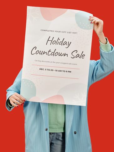 Person holding a Holiday Countdown Sale poster against a red background.