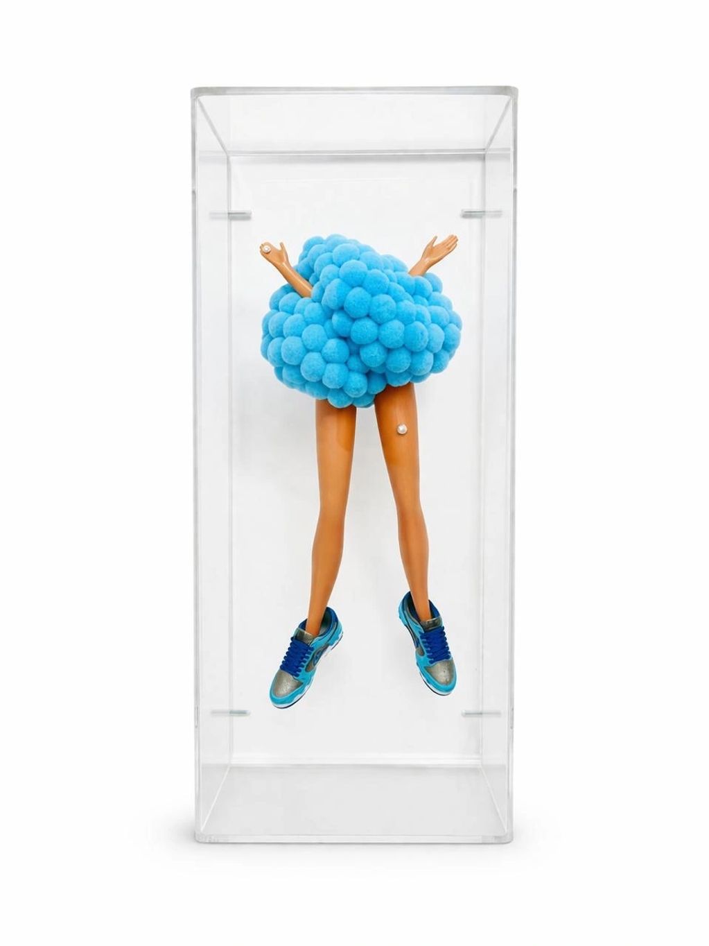 Surreal sculpture of legs and arms emerging from a blue pom-pom cloud in a clear box.