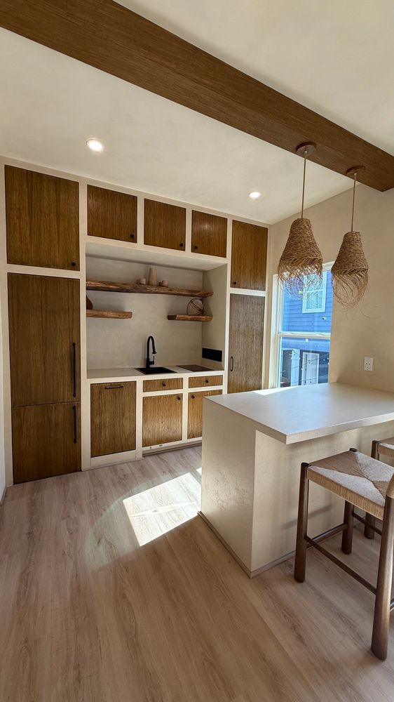 Earth tone Limewash on walls and ceiling. Microcement applied on countertops and cabinets. DA Paint