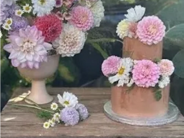 Two tier chocolate cake decorated with fresh flowers