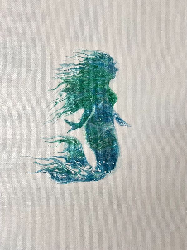 Artistic silhouette of a mermaid with flowing hair and tail in blue and green hues.