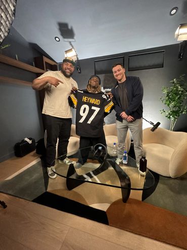 Cam Heyward, Lil Wayne, and Hayden Walsh smiling with Cam Heyward's jersey.