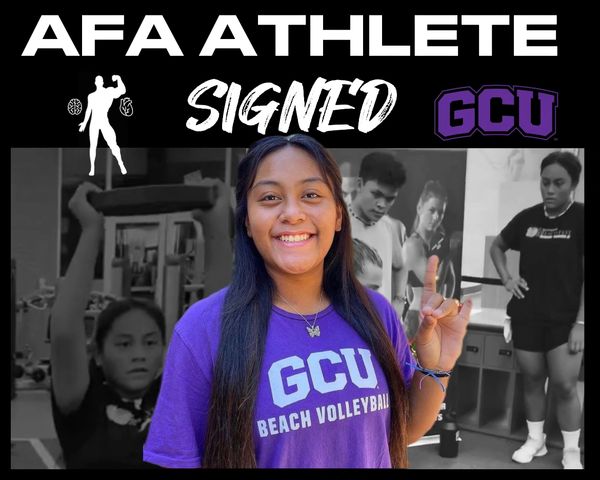 A female athlete proudly signing with GCU for beach volleyball.