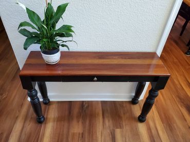 Custom entry table made from Jatoba with pine  base, drawers, and turned legs. Epoxy top coat