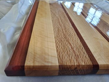 Cutting board with chamfered edges various hardwoods including Brazilian Cherry, Maple,  Live Oak