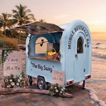 A mobile beverage bar at the beach during sunset.