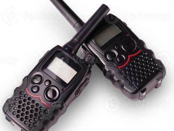Two black walkie-talkies with antennas.