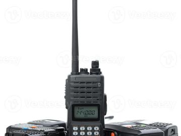 Three black handheld walkie-talkies.