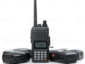 Three black handheld walkie-talkies.