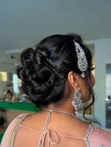 Elegant twisted bridal updo with Indian Jhumar hair accessory by NYC hairstylist, Beauty by Denoise