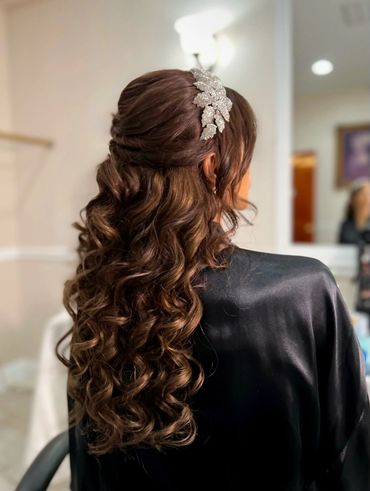 Curly wedding half updo with extensions and bridal headpiece by NYC hairstylist, Beauty by Denoise