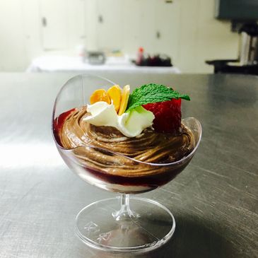 Chocolate and white chocolate mousse cup with Raspberry coulis. 