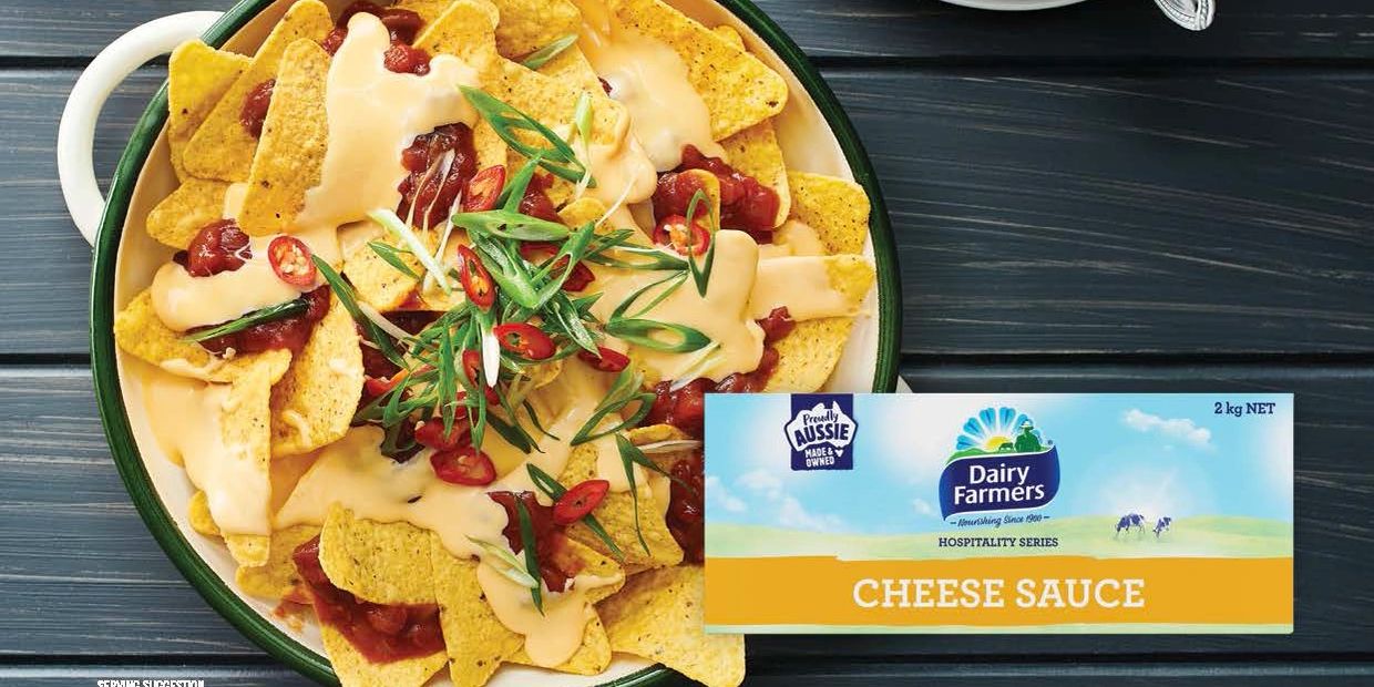 Bowl of nachos with cheese sauce poured on top