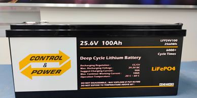 Deep cycle lithium battery labeled Control &amp; Power with 25.6V 100Ah specifications.