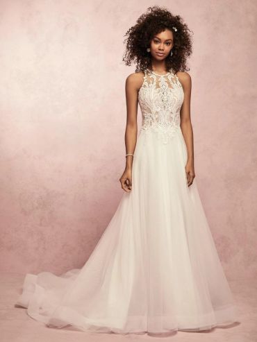Elegant white lace wedding dress with a flowing skirt.