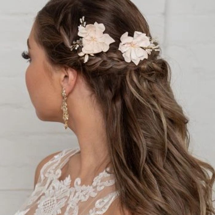 Elegant braided hairstyle with floral accessories