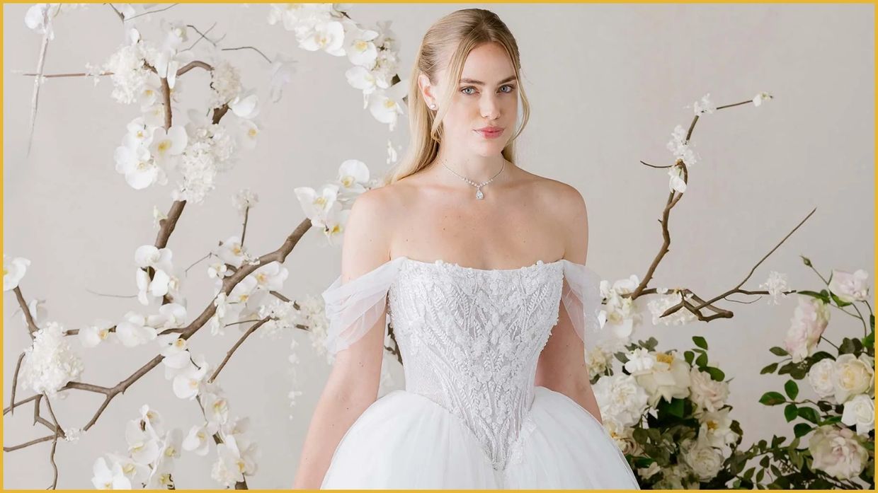  Style : 1010036. Strapless scoop neck gown with tulle sleeves, beaded bodice, corset back, and trai