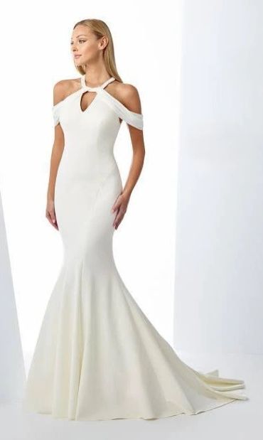 Elegant white off-shoulder mermaid gown.