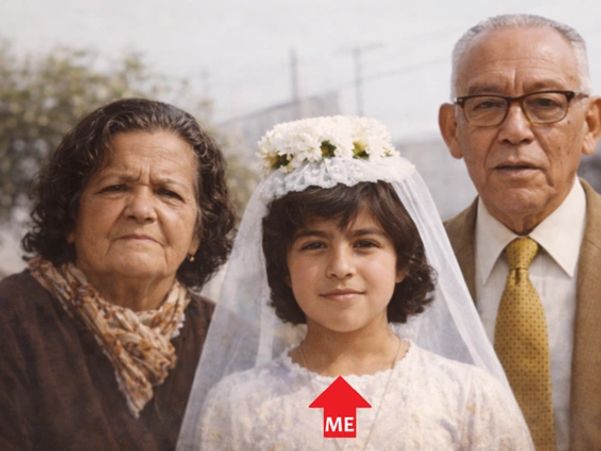 Young girl in a white dress with grandparents posing for a photo.