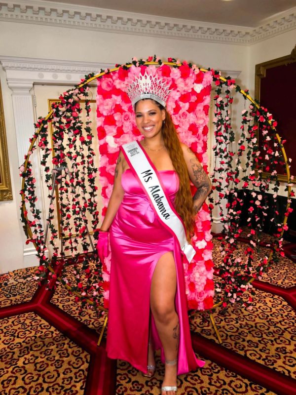 Woman in pink gown and crown with MS Alabama sash.