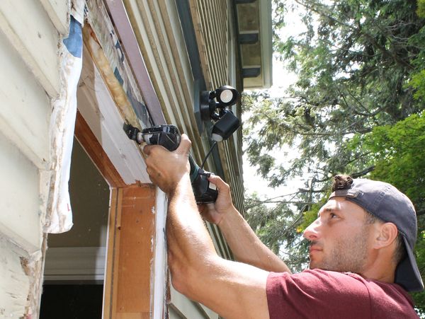 Anthony Alberico replacing a window on a historic home in Watertown Massachusetts