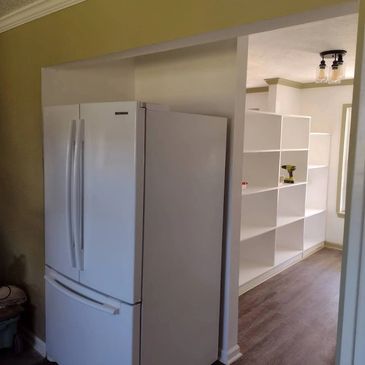 This is where we remodeled the kitchen and built the wall so that the refrigerator could be pushed b