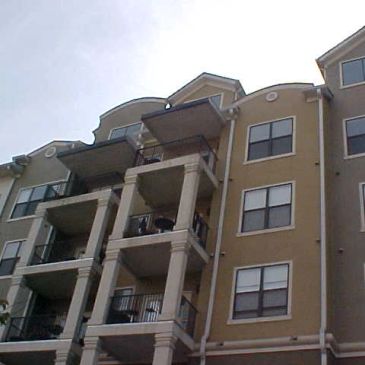 Exterior view of a modern apartment building with balconies.