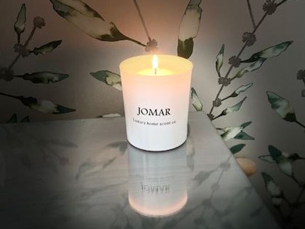 Elevate your space with the soft glow and soothing aroma of our JOMAR candle . 