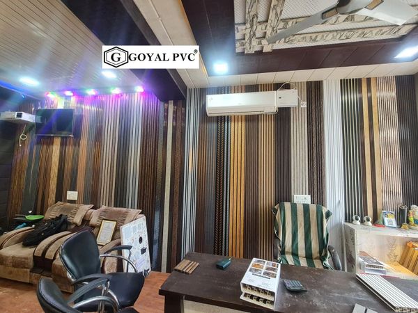 Modern office with striped wall panels, cozy seating, and air conditioning.